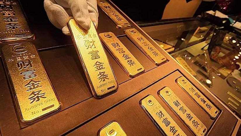 Китай наращивает резервы золота, готовясь к санкциям США