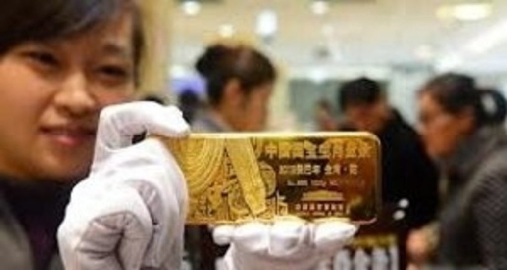 Резервы КНР превысили мировой запас золота вдвое